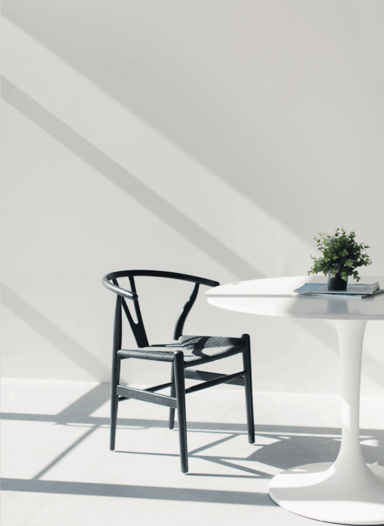 empty black chair in a modern white office