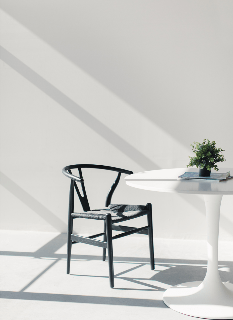 empty black chair in a modern white office